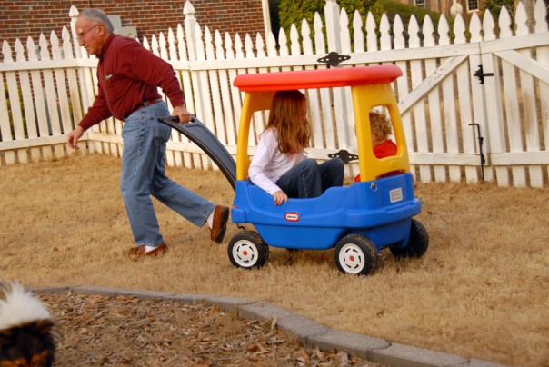 Grandpa pulling Madeline and EK in the wagon