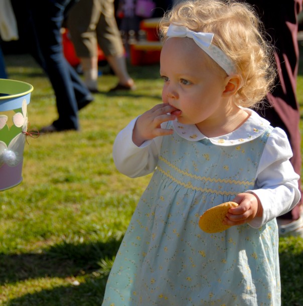 She's more concerned w/ her cookie than the Easter eggs. Who can blame her?