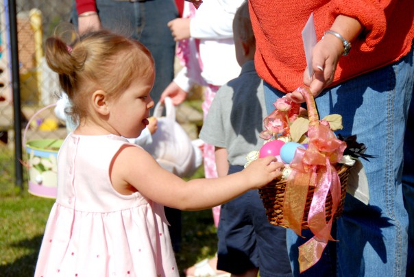 Emma Kate's friend Brittain has a basket full of eggs.