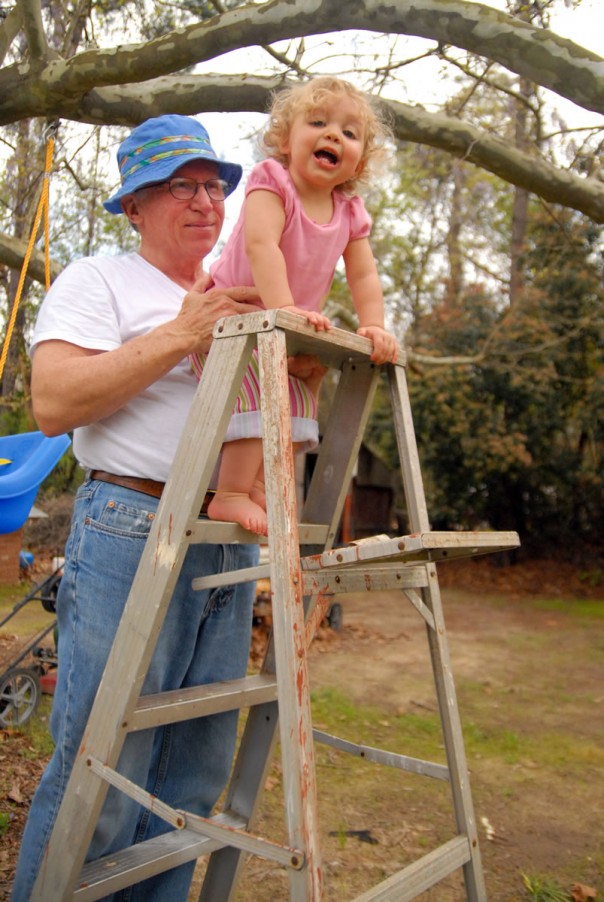 Grandpa (in his J Crew hat) letting Emma Kate climb up a ladder